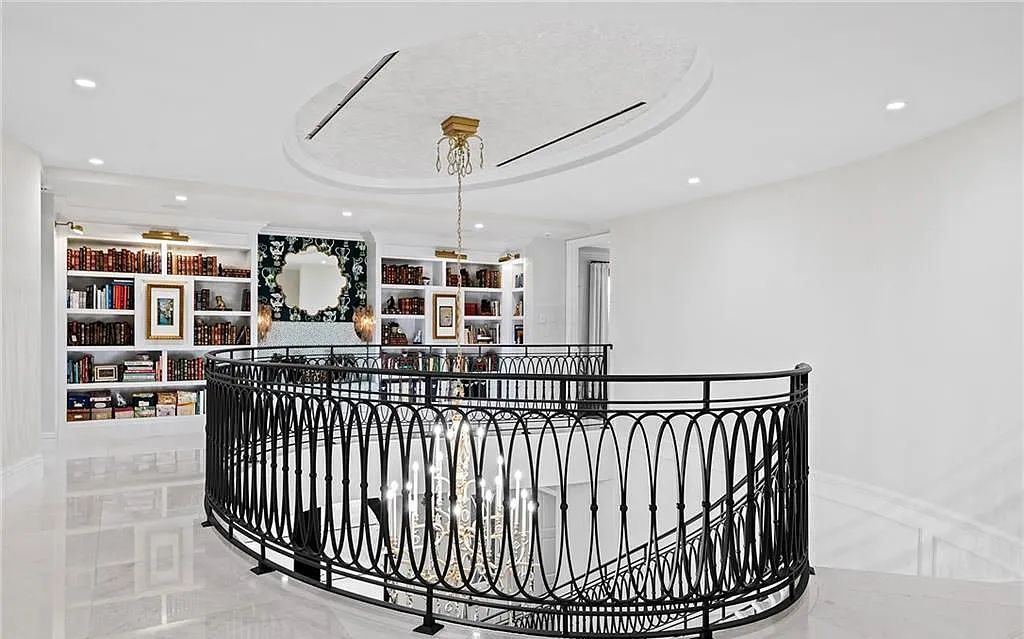 Welcome to 633 Isle of Palms Drive in Fort Lauderdale, Florida, where luxury living meets bespoke grandeur. This custom-built residence features 5 bedrooms, 8 bathrooms, and 7,970 square feet of living space on a 0.30-acre lot with a 100-foot dock, 21K lift, and a resort-like salt pool and spa.