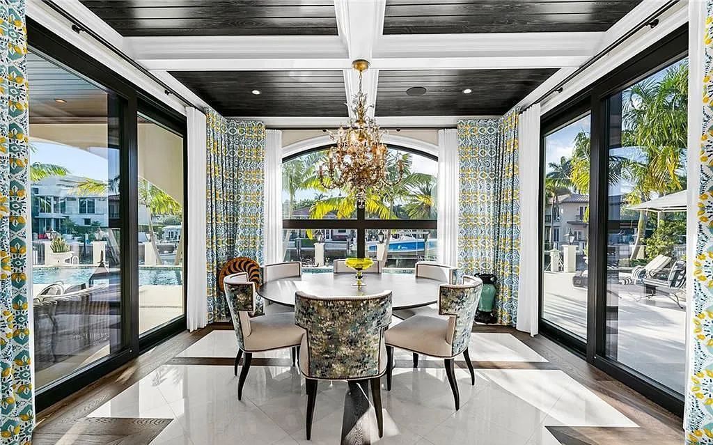 Welcome to 633 Isle of Palms Drive in Fort Lauderdale, Florida, where luxury living meets bespoke grandeur. This custom-built residence features 5 bedrooms, 8 bathrooms, and 7,970 square feet of living space on a 0.30-acre lot with a 100-foot dock, 21K lift, and a resort-like salt pool and spa.