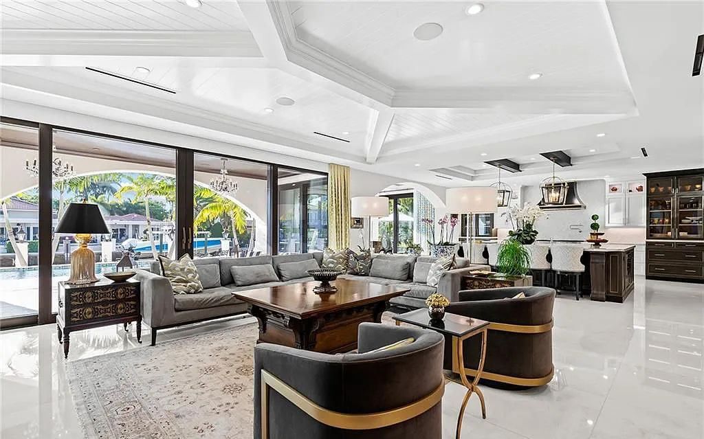 Welcome to 633 Isle of Palms Drive in Fort Lauderdale, Florida, where luxury living meets bespoke grandeur. This custom-built residence features 5 bedrooms, 8 bathrooms, and 7,970 square feet of living space on a 0.30-acre lot with a 100-foot dock, 21K lift, and a resort-like salt pool and spa.
