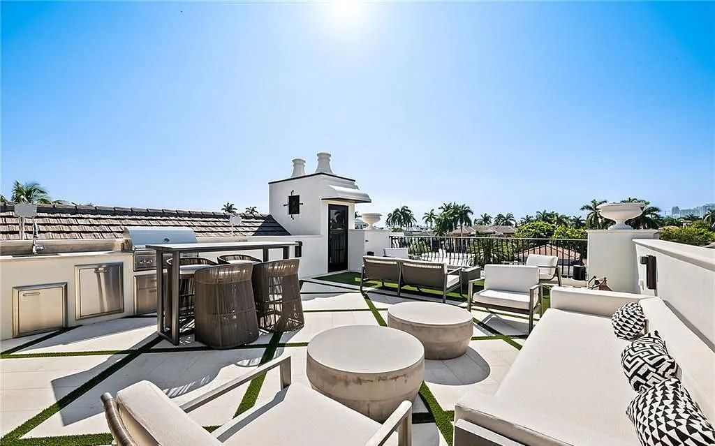 Welcome to 633 Isle of Palms Drive in Fort Lauderdale, Florida, where luxury living meets bespoke grandeur. This custom-built residence features 5 bedrooms, 8 bathrooms, and 7,970 square feet of living space on a 0.30-acre lot with a 100-foot dock, 21K lift, and a resort-like salt pool and spa.