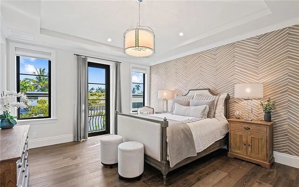 Welcome to 633 Isle of Palms Drive in Fort Lauderdale, Florida, where luxury living meets bespoke grandeur. This custom-built residence features 5 bedrooms, 8 bathrooms, and 7,970 square feet of living space on a 0.30-acre lot with a 100-foot dock, 21K lift, and a resort-like salt pool and spa.