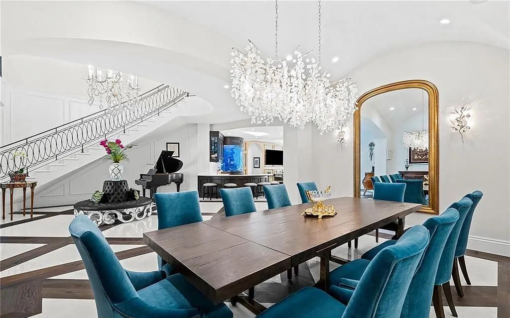 Welcome to 633 Isle of Palms Drive in Fort Lauderdale, Florida, where luxury living meets bespoke grandeur. This custom-built residence features 5 bedrooms, 8 bathrooms, and 7,970 square feet of living space on a 0.30-acre lot with a 100-foot dock, 21K lift, and a resort-like salt pool and spa.