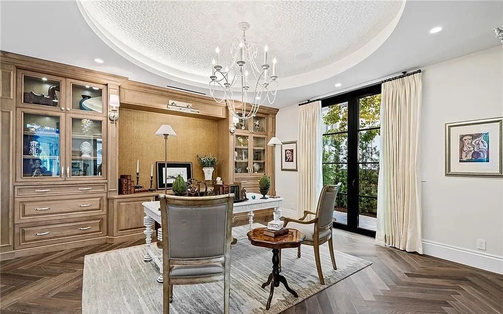 Welcome to 633 Isle of Palms Drive in Fort Lauderdale, Florida, where luxury living meets bespoke grandeur. This custom-built residence features 5 bedrooms, 8 bathrooms, and 7,970 square feet of living space on a 0.30-acre lot with a 100-foot dock, 21K lift, and a resort-like salt pool and spa.