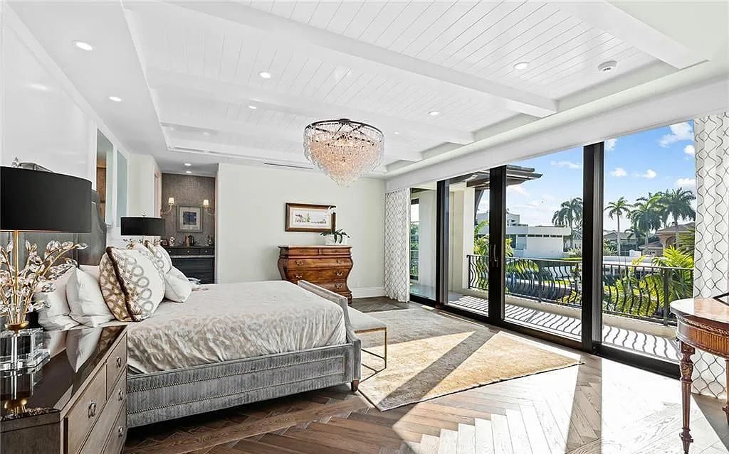 Welcome to 633 Isle of Palms Drive in Fort Lauderdale, Florida, where luxury living meets bespoke grandeur. This custom-built residence features 5 bedrooms, 8 bathrooms, and 7,970 square feet of living space on a 0.30-acre lot with a 100-foot dock, 21K lift, and a resort-like salt pool and spa.