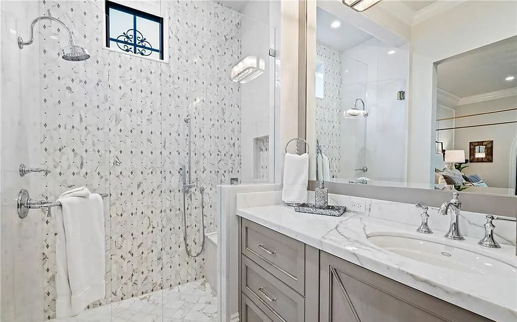 Welcome to 633 Isle of Palms Drive in Fort Lauderdale, Florida, where luxury living meets bespoke grandeur. This custom-built residence features 5 bedrooms, 8 bathrooms, and 7,970 square feet of living space on a 0.30-acre lot with a 100-foot dock, 21K lift, and a resort-like salt pool and spa.