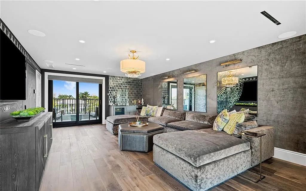 Welcome to 633 Isle of Palms Drive in Fort Lauderdale, Florida, where luxury living meets bespoke grandeur. This custom-built residence features 5 bedrooms, 8 bathrooms, and 7,970 square feet of living space on a 0.30-acre lot with a 100-foot dock, 21K lift, and a resort-like salt pool and spa.