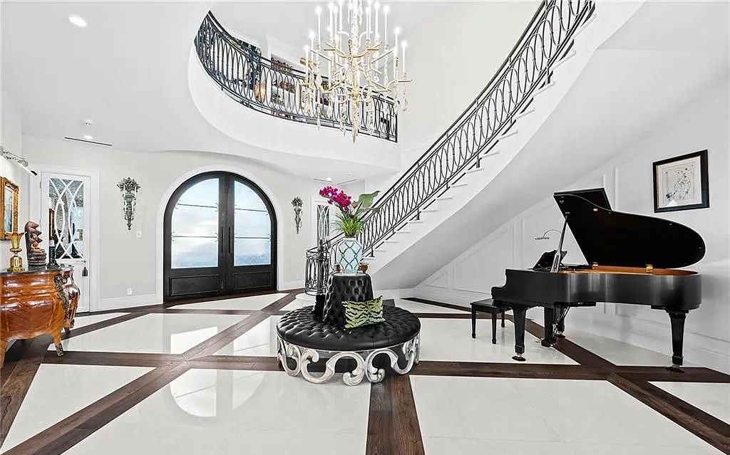 Welcome to 633 Isle of Palms Drive in Fort Lauderdale, Florida, where luxury living meets bespoke grandeur. This custom-built residence features 5 bedrooms, 8 bathrooms, and 7,970 square feet of living space on a 0.30-acre lot with a 100-foot dock, 21K lift, and a resort-like salt pool and spa.