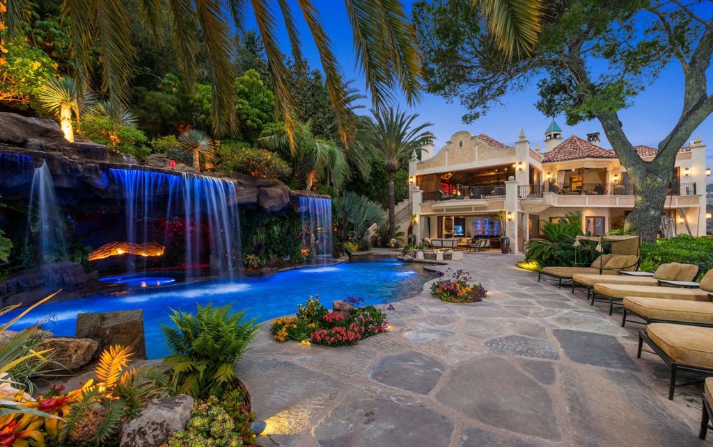Experience opulent living in Beverly Hills' most desirable zip code with The Cielo Estate. This palatial Andalusian-style masterpiece features 9 bedrooms, 18 bathrooms, 21,000 sq. ft. living space, and 3.60 acres lot size. Enjoy breathtaking city and ocean views, a detached guest house, movie theatre, spa, gym, billiards room, bar, and a 75-yard pool with 3 waterfalls, 2 spas, a 35-foot water slide, and more.