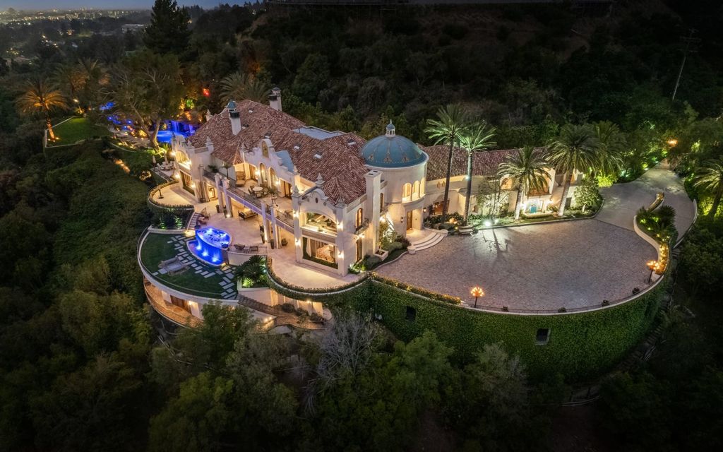 Experience opulent living in Beverly Hills' most desirable zip code with The Cielo Estate. This palatial Andalusian-style masterpiece features 9 bedrooms, 18 bathrooms, 21,000 sq. ft. living space, and 3.60 acres lot size. Enjoy breathtaking city and ocean views, a detached guest house, movie theatre, spa, gym, billiards room, bar, and a 75-yard pool with 3 waterfalls, 2 spas, a 35-foot water slide, and more.