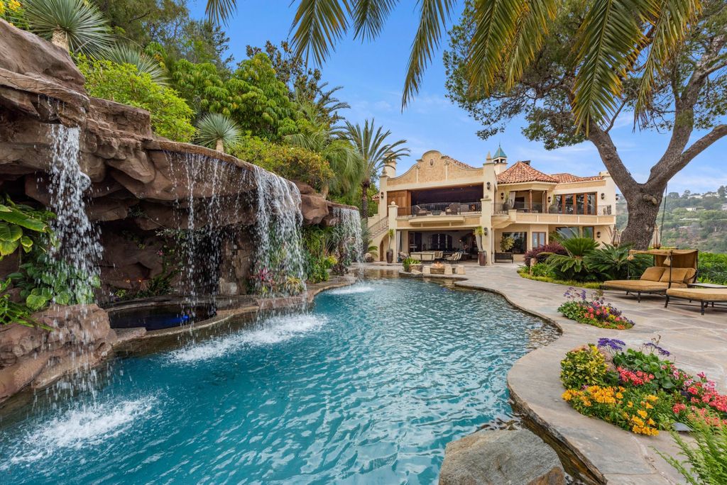 Experience opulent living in Beverly Hills' most desirable zip code with The Cielo Estate. This palatial Andalusian-style masterpiece features 9 bedrooms, 18 bathrooms, 21,000 sq. ft. living space, and 3.60 acres lot size. Enjoy breathtaking city and ocean views, a detached guest house, movie theatre, spa, gym, billiards room, bar, and a 75-yard pool with 3 waterfalls, 2 spas, a 35-foot water slide, and more.