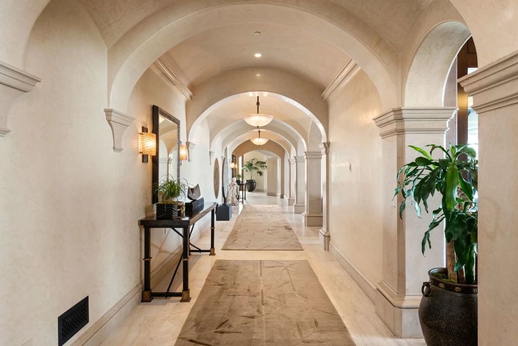 Experience opulent living in Beverly Hills' most desirable zip code with The Cielo Estate. This palatial Andalusian-style masterpiece features 9 bedrooms, 18 bathrooms, 21,000 sq. ft. living space, and 3.60 acres lot size. Enjoy breathtaking city and ocean views, a detached guest house, movie theatre, spa, gym, billiards room, bar, and a 75-yard pool with 3 waterfalls, 2 spas, a 35-foot water slide, and more.
