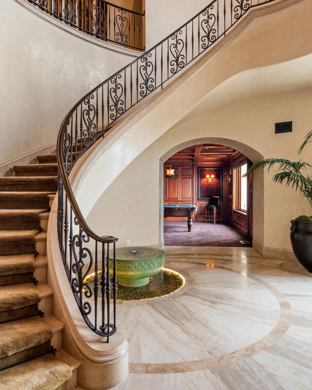 Experience opulent living in Beverly Hills' most desirable zip code with The Cielo Estate. This palatial Andalusian-style masterpiece features 9 bedrooms, 18 bathrooms, 21,000 sq. ft. living space, and 3.60 acres lot size. Enjoy breathtaking city and ocean views, a detached guest house, movie theatre, spa, gym, billiards room, bar, and a 75-yard pool with 3 waterfalls, 2 spas, a 35-foot water slide, and more.