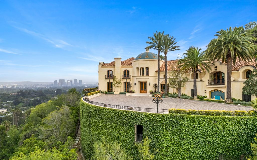 Experience opulent living in Beverly Hills' most desirable zip code with The Cielo Estate. This palatial Andalusian-style masterpiece features 9 bedrooms, 18 bathrooms, 21,000 sq. ft. living space, and 3.60 acres lot size. Enjoy breathtaking city and ocean views, a detached guest house, movie theatre, spa, gym, billiards room, bar, and a 75-yard pool with 3 waterfalls, 2 spas, a 35-foot water slide, and more.