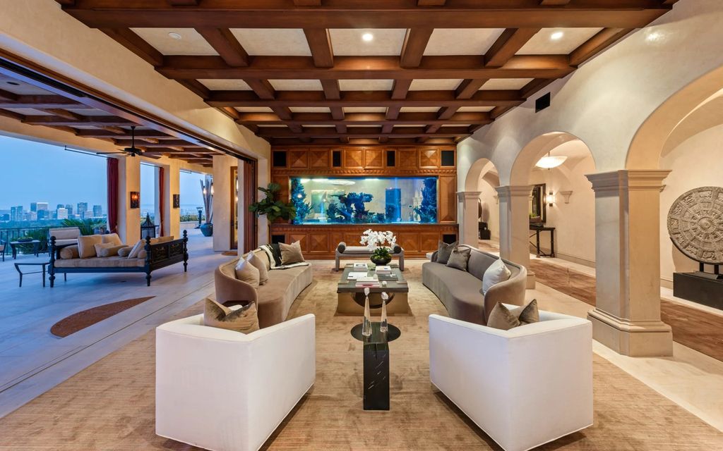 Experience opulent living in Beverly Hills' most desirable zip code with The Cielo Estate. This palatial Andalusian-style masterpiece features 9 bedrooms, 18 bathrooms, 21,000 sq. ft. living space, and 3.60 acres lot size. Enjoy breathtaking city and ocean views, a detached guest house, movie theatre, spa, gym, billiards room, bar, and a 75-yard pool with 3 waterfalls, 2 spas, a 35-foot water slide, and more.