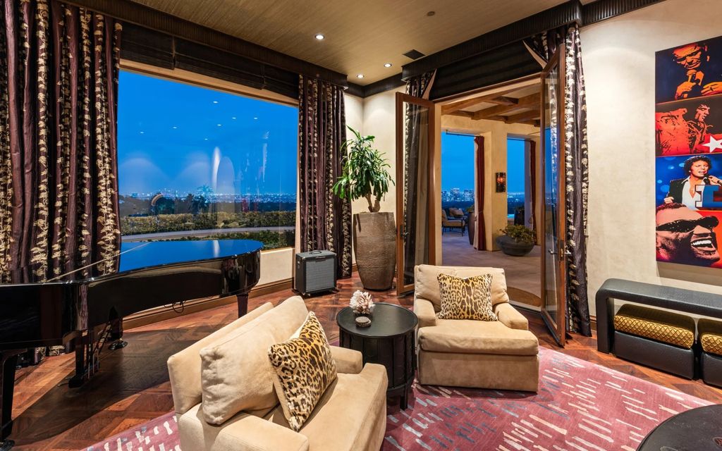 Experience opulent living in Beverly Hills' most desirable zip code with The Cielo Estate. This palatial Andalusian-style masterpiece features 9 bedrooms, 18 bathrooms, 21,000 sq. ft. living space, and 3.60 acres lot size. Enjoy breathtaking city and ocean views, a detached guest house, movie theatre, spa, gym, billiards room, bar, and a 75-yard pool with 3 waterfalls, 2 spas, a 35-foot water slide, and more.