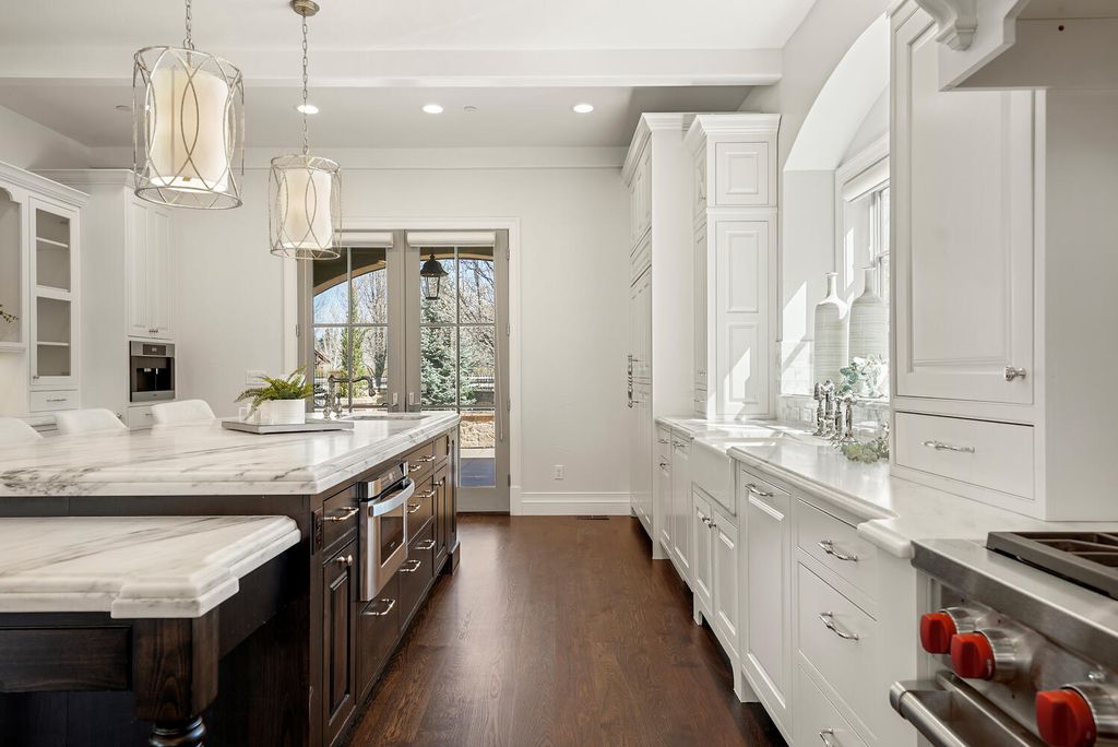 1110 E Layton Avenue Home in Cherry Hills Village, Colorado. This stunning home in the heart of Old Cherry Hills Village offers classical form and style with modern renovations and top-of-the-line finishes. The spacious layout boasts vaulted ceilings and private spaces with unique views from every window.