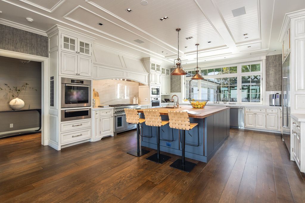 This stunning estate located at 1678 Alta Mura Rd in Pacific Palisades, California 90272, is a true gem of the Palisades Riviera. Boasting 8 bedrooms, 14 bathrooms, and a living space of 16,000 square feet on a 1.08-acre lot, this LEED-certified compound offers luxury and privacy in an unbeatable location.