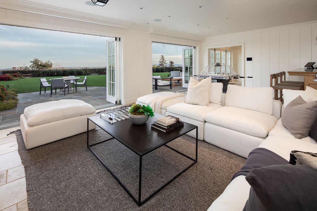 This stunning estate located at 1678 Alta Mura Rd in Pacific Palisades, California 90272, is a true gem of the Palisades Riviera. Boasting 8 bedrooms, 14 bathrooms, and a living space of 16,000 square feet on a 1.08-acre lot, this LEED-certified compound offers luxury and privacy in an unbeatable location.