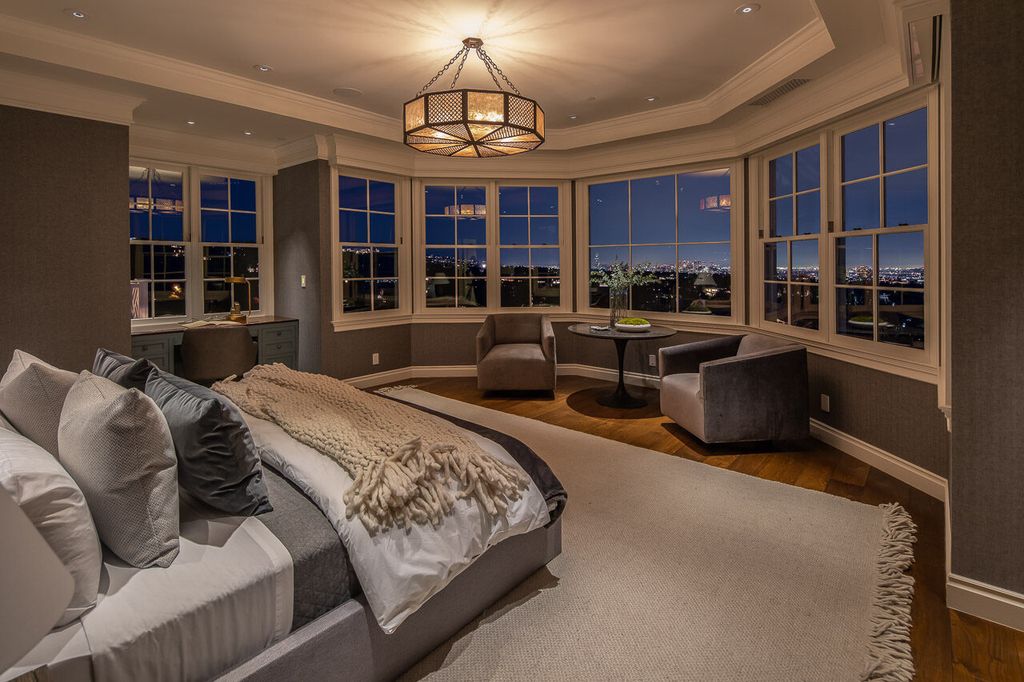 This stunning estate located at 1678 Alta Mura Rd in Pacific Palisades, California 90272, is a true gem of the Palisades Riviera. Boasting 8 bedrooms, 14 bathrooms, and a living space of 16,000 square feet on a 1.08-acre lot, this LEED-certified compound offers luxury and privacy in an unbeatable location.