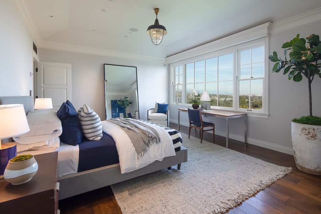 This stunning estate located at 1678 Alta Mura Rd in Pacific Palisades, California 90272, is a true gem of the Palisades Riviera. Boasting 8 bedrooms, 14 bathrooms, and a living space of 16,000 square feet on a 1.08-acre lot, this LEED-certified compound offers luxury and privacy in an unbeatable location.