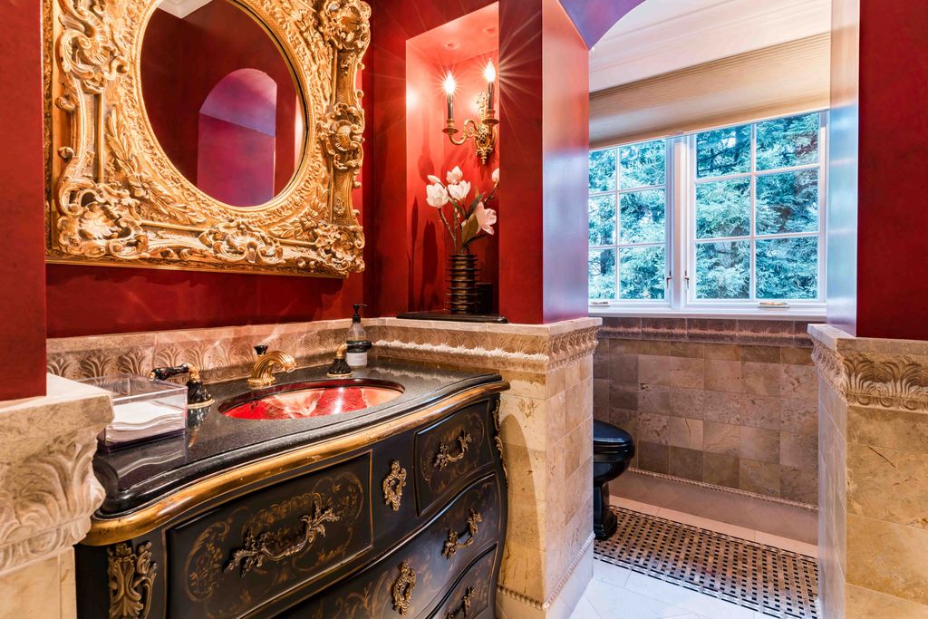 18 Cowell Lane Home in Atherton, California. Indulge in the perfect blend of privacy and luxury within the serene surroundings of this magnificent Atherton estate. Nestled on over an acre of meticulously maintained grounds, this exceptional home exudes style and elegance at every turn, boasting over 6,800 square feet of living space. Impeccable craftsmanship is showcased throughout, with exquisite details including stone, marble, and mahogany finishes. 