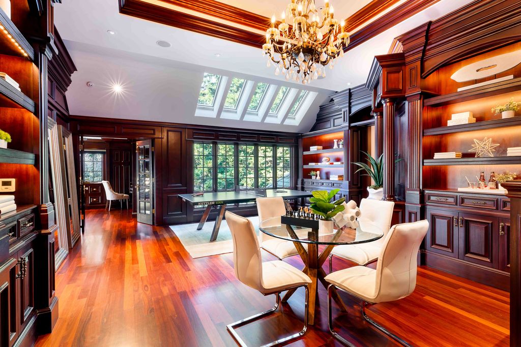 18 Cowell Lane Home in Atherton, California. Indulge in the perfect blend of privacy and luxury within the serene surroundings of this magnificent Atherton estate. Nestled on over an acre of meticulously maintained grounds, this exceptional home exudes style and elegance at every turn, boasting over 6,800 square feet of living space. Impeccable craftsmanship is showcased throughout, with exquisite details including stone, marble, and mahogany finishes. 