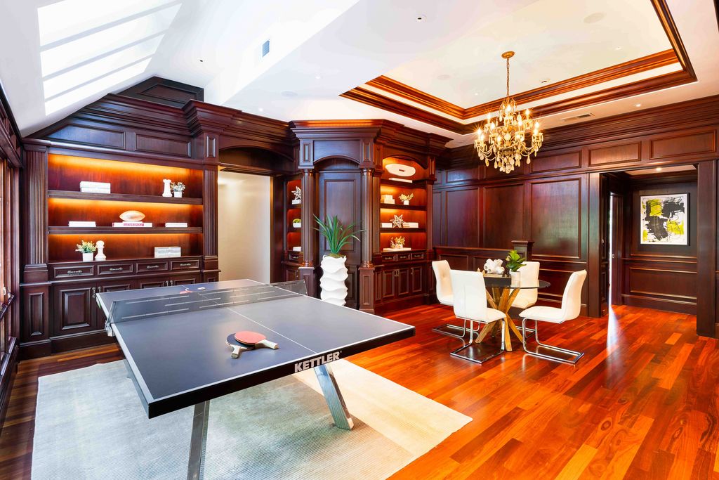 18 Cowell Lane Home in Atherton, California. Indulge in the perfect blend of privacy and luxury within the serene surroundings of this magnificent Atherton estate. Nestled on over an acre of meticulously maintained grounds, this exceptional home exudes style and elegance at every turn, boasting over 6,800 square feet of living space. Impeccable craftsmanship is showcased throughout, with exquisite details including stone, marble, and mahogany finishes. 