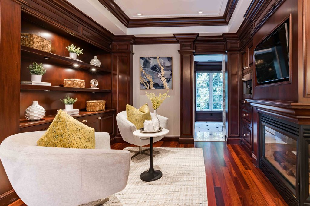 18 Cowell Lane Home in Atherton, California. Indulge in the perfect blend of privacy and luxury within the serene surroundings of this magnificent Atherton estate. Nestled on over an acre of meticulously maintained grounds, this exceptional home exudes style and elegance at every turn, boasting over 6,800 square feet of living space. Impeccable craftsmanship is showcased throughout, with exquisite details including stone, marble, and mahogany finishes. 
