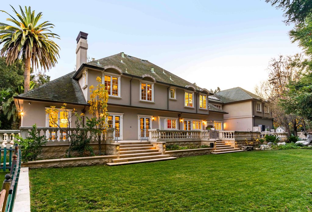 18 Cowell Lane Home in Atherton, California. Indulge in the perfect blend of privacy and luxury within the serene surroundings of this magnificent Atherton estate. Nestled on over an acre of meticulously maintained grounds, this exceptional home exudes style and elegance at every turn, boasting over 6,800 square feet of living space. Impeccable craftsmanship is showcased throughout, with exquisite details including stone, marble, and mahogany finishes. 