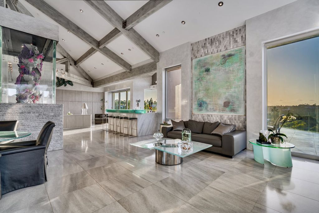 Located at 6002 Via Posada Del Norte in Rancho Santa Fe, CA, this stunning contemporary home is a dream come true. Boasting 12 bedrooms, 10 bathrooms, and a living space of 12,745 square feet, this home is truly one-of-a-kind. Built in 2006, it sits on one of the most coveted lots in the prestigious guard-gated community of Fairbanks Ranch.