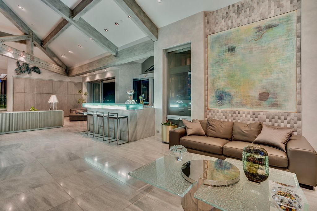 Located at 6002 Via Posada Del Norte in Rancho Santa Fe, CA, this stunning contemporary home is a dream come true. Boasting 12 bedrooms, 10 bathrooms, and a living space of 12,745 square feet, this home is truly one-of-a-kind. Built in 2006, it sits on one of the most coveted lots in the prestigious guard-gated community of Fairbanks Ranch.