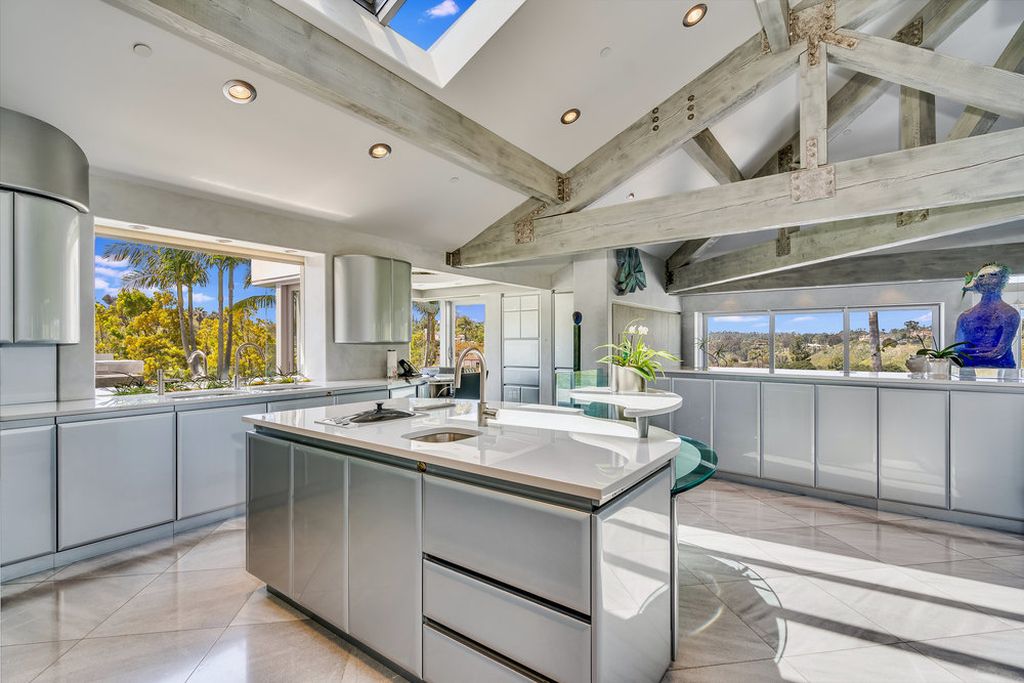 Located at 6002 Via Posada Del Norte in Rancho Santa Fe, CA, this stunning contemporary home is a dream come true. Boasting 12 bedrooms, 10 bathrooms, and a living space of 12,745 square feet, this home is truly one-of-a-kind. Built in 2006, it sits on one of the most coveted lots in the prestigious guard-gated community of Fairbanks Ranch.