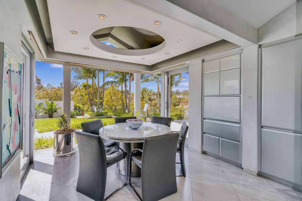 Located at 6002 Via Posada Del Norte in Rancho Santa Fe, CA, this stunning contemporary home is a dream come true. Boasting 12 bedrooms, 10 bathrooms, and a living space of 12,745 square feet, this home is truly one-of-a-kind. Built in 2006, it sits on one of the most coveted lots in the prestigious guard-gated community of Fairbanks Ranch.