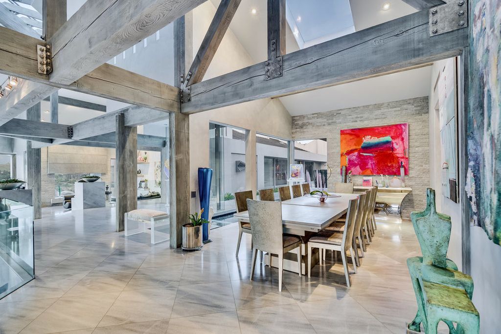 Located at 6002 Via Posada Del Norte in Rancho Santa Fe, CA, this stunning contemporary home is a dream come true. Boasting 12 bedrooms, 10 bathrooms, and a living space of 12,745 square feet, this home is truly one-of-a-kind. Built in 2006, it sits on one of the most coveted lots in the prestigious guard-gated community of Fairbanks Ranch.