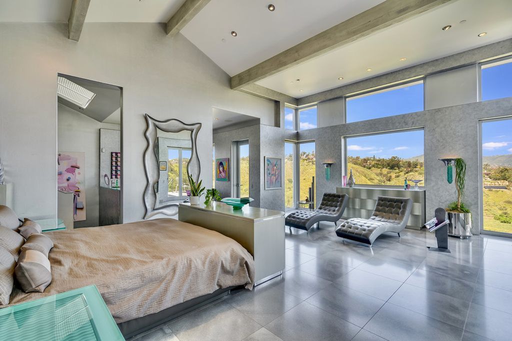 Located at 6002 Via Posada Del Norte in Rancho Santa Fe, CA, this stunning contemporary home is a dream come true. Boasting 12 bedrooms, 10 bathrooms, and a living space of 12,745 square feet, this home is truly one-of-a-kind. Built in 2006, it sits on one of the most coveted lots in the prestigious guard-gated community of Fairbanks Ranch.