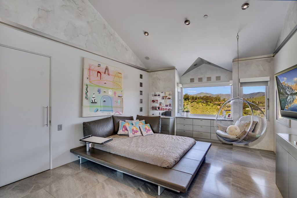 Located at 6002 Via Posada Del Norte in Rancho Santa Fe, CA, this stunning contemporary home is a dream come true. Boasting 12 bedrooms, 10 bathrooms, and a living space of 12,745 square feet, this home is truly one-of-a-kind. Built in 2006, it sits on one of the most coveted lots in the prestigious guard-gated community of Fairbanks Ranch.