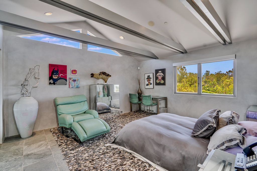 Located at 6002 Via Posada Del Norte in Rancho Santa Fe, CA, this stunning contemporary home is a dream come true. Boasting 12 bedrooms, 10 bathrooms, and a living space of 12,745 square feet, this home is truly one-of-a-kind. Built in 2006, it sits on one of the most coveted lots in the prestigious guard-gated community of Fairbanks Ranch.