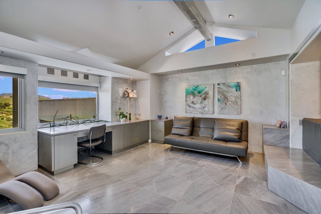 Located at 6002 Via Posada Del Norte in Rancho Santa Fe, CA, this stunning contemporary home is a dream come true. Boasting 12 bedrooms, 10 bathrooms, and a living space of 12,745 square feet, this home is truly one-of-a-kind. Built in 2006, it sits on one of the most coveted lots in the prestigious guard-gated community of Fairbanks Ranch.