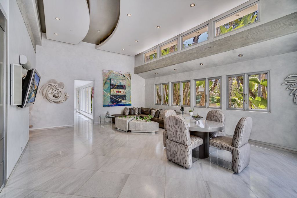 Located at 6002 Via Posada Del Norte in Rancho Santa Fe, CA, this stunning contemporary home is a dream come true. Boasting 12 bedrooms, 10 bathrooms, and a living space of 12,745 square feet, this home is truly one-of-a-kind. Built in 2006, it sits on one of the most coveted lots in the prestigious guard-gated community of Fairbanks Ranch.
