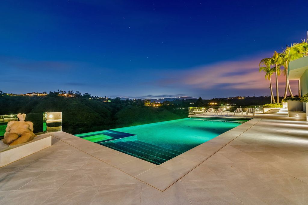 Located at 6002 Via Posada Del Norte in Rancho Santa Fe, CA, this stunning contemporary home is a dream come true. Boasting 12 bedrooms, 10 bathrooms, and a living space of 12,745 square feet, this home is truly one-of-a-kind. Built in 2006, it sits on one of the most coveted lots in the prestigious guard-gated community of Fairbanks Ranch.
