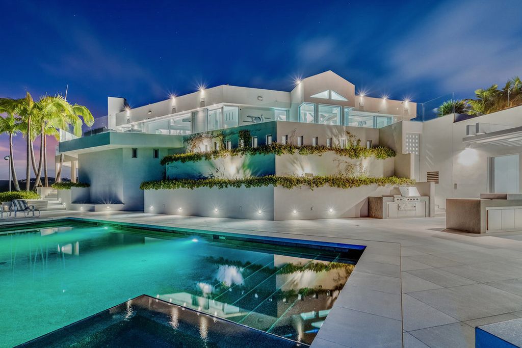 Located at 6002 Via Posada Del Norte in Rancho Santa Fe, CA, this stunning contemporary home is a dream come true. Boasting 12 bedrooms, 10 bathrooms, and a living space of 12,745 square feet, this home is truly one-of-a-kind. Built in 2006, it sits on one of the most coveted lots in the prestigious guard-gated community of Fairbanks Ranch.