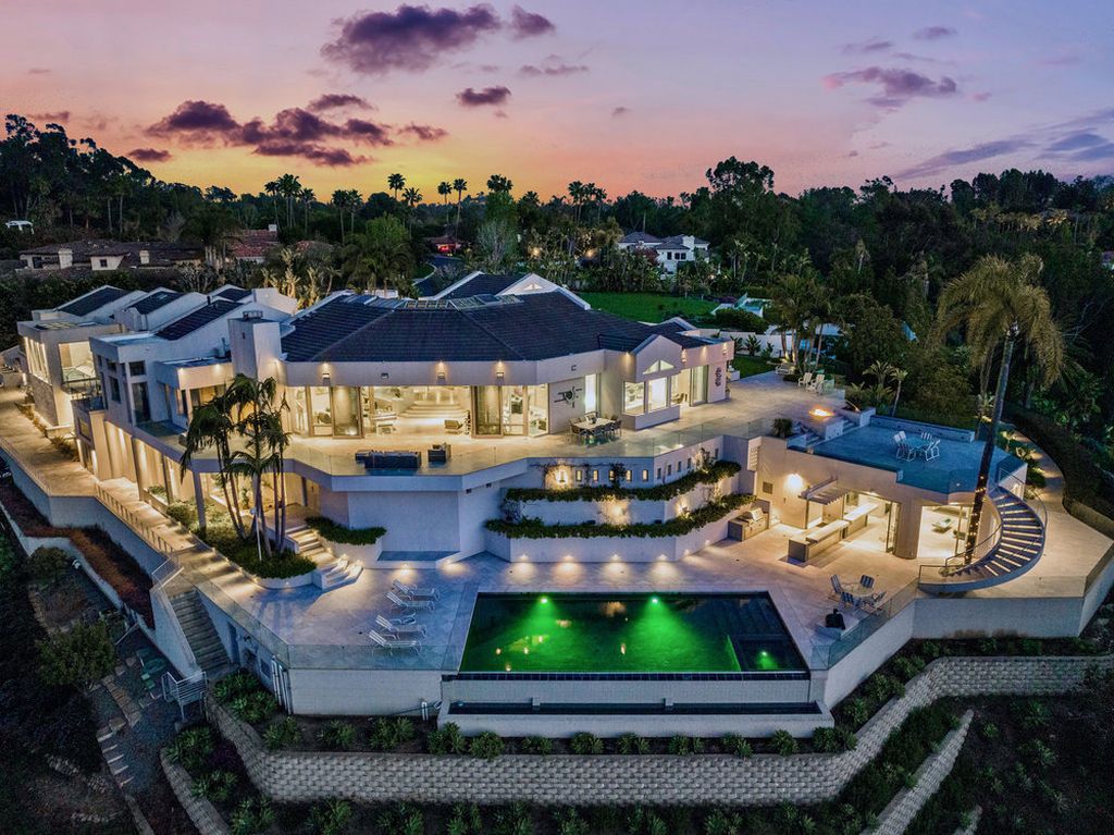 Located at 6002 Via Posada Del Norte in Rancho Santa Fe, CA, this stunning contemporary home is a dream come true. Boasting 12 bedrooms, 10 bathrooms, and a living space of 12,745 square feet, this home is truly one-of-a-kind. Built in 2006, it sits on one of the most coveted lots in the prestigious guard-gated community of Fairbanks Ranch.
