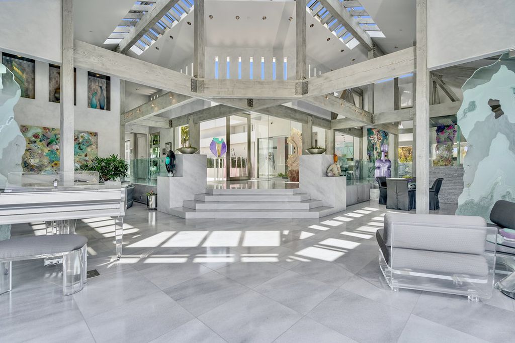 Located at 6002 Via Posada Del Norte in Rancho Santa Fe, CA, this stunning contemporary home is a dream come true. Boasting 12 bedrooms, 10 bathrooms, and a living space of 12,745 square feet, this home is truly one-of-a-kind. Built in 2006, it sits on one of the most coveted lots in the prestigious guard-gated community of Fairbanks Ranch.
