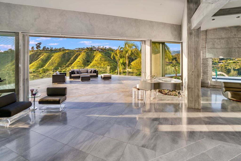 Located at 6002 Via Posada Del Norte in Rancho Santa Fe, CA, this stunning contemporary home is a dream come true. Boasting 12 bedrooms, 10 bathrooms, and a living space of 12,745 square feet, this home is truly one-of-a-kind. Built in 2006, it sits on one of the most coveted lots in the prestigious guard-gated community of Fairbanks Ranch.