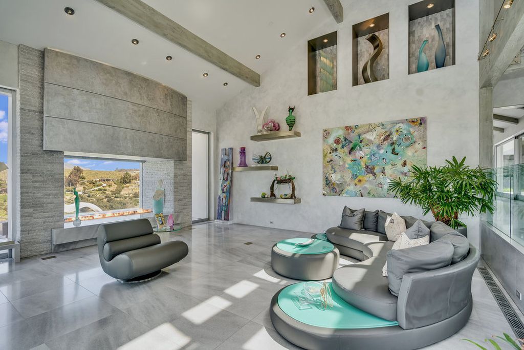 Located at 6002 Via Posada Del Norte in Rancho Santa Fe, CA, this stunning contemporary home is a dream come true. Boasting 12 bedrooms, 10 bathrooms, and a living space of 12,745 square feet, this home is truly one-of-a-kind. Built in 2006, it sits on one of the most coveted lots in the prestigious guard-gated community of Fairbanks Ranch.