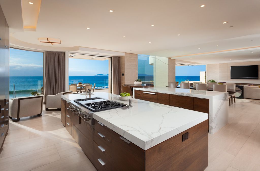 7 Strand Beach Drive in Dana Point, CA is an exquisite property that boasts breathtaking Pacific Ocean views, unparalleled contemporary architecture, and a prime location at The Strand at Headlands. Built in 2018 by Brown Brothers Construction, this modern custom showplace features approximately 9,630 square feet of living space, six ensuite bedrooms, and seven-and-a-half baths, including two primary suites and a junior suite on the top level.