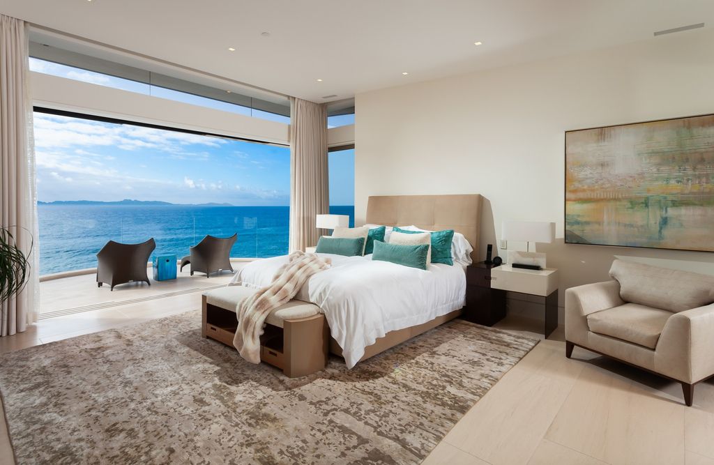 7 Strand Beach Drive in Dana Point, CA is an exquisite property that boasts breathtaking Pacific Ocean views, unparalleled contemporary architecture, and a prime location at The Strand at Headlands. Built in 2018 by Brown Brothers Construction, this modern custom showplace features approximately 9,630 square feet of living space, six ensuite bedrooms, and seven-and-a-half baths, including two primary suites and a junior suite on the top level.