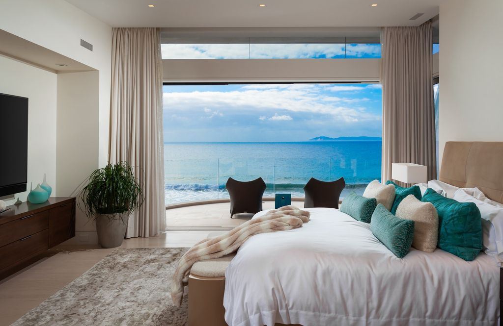 7 Strand Beach Drive in Dana Point, CA is an exquisite property that boasts breathtaking Pacific Ocean views, unparalleled contemporary architecture, and a prime location at The Strand at Headlands. Built in 2018 by Brown Brothers Construction, this modern custom showplace features approximately 9,630 square feet of living space, six ensuite bedrooms, and seven-and-a-half baths, including two primary suites and a junior suite on the top level.