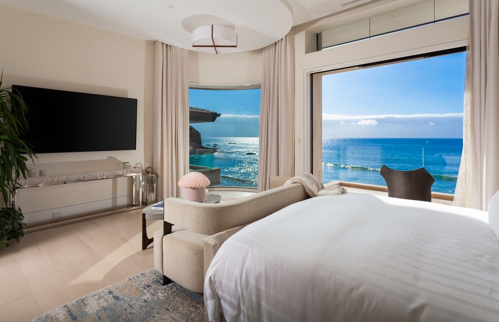 7 Strand Beach Drive in Dana Point, CA is an exquisite property that boasts breathtaking Pacific Ocean views, unparalleled contemporary architecture, and a prime location at The Strand at Headlands. Built in 2018 by Brown Brothers Construction, this modern custom showplace features approximately 9,630 square feet of living space, six ensuite bedrooms, and seven-and-a-half baths, including two primary suites and a junior suite on the top level.