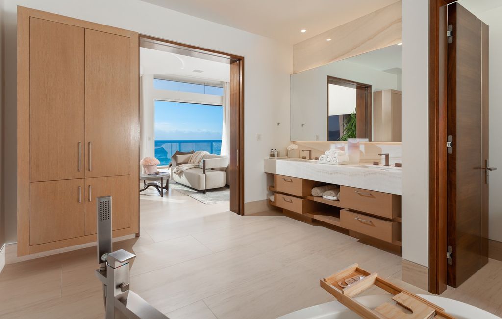 7 Strand Beach Drive in Dana Point, CA is an exquisite property that boasts breathtaking Pacific Ocean views, unparalleled contemporary architecture, and a prime location at The Strand at Headlands. Built in 2018 by Brown Brothers Construction, this modern custom showplace features approximately 9,630 square feet of living space, six ensuite bedrooms, and seven-and-a-half baths, including two primary suites and a junior suite on the top level.